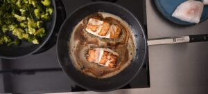 Prepared cod on a Ztove non-stick pan with butter